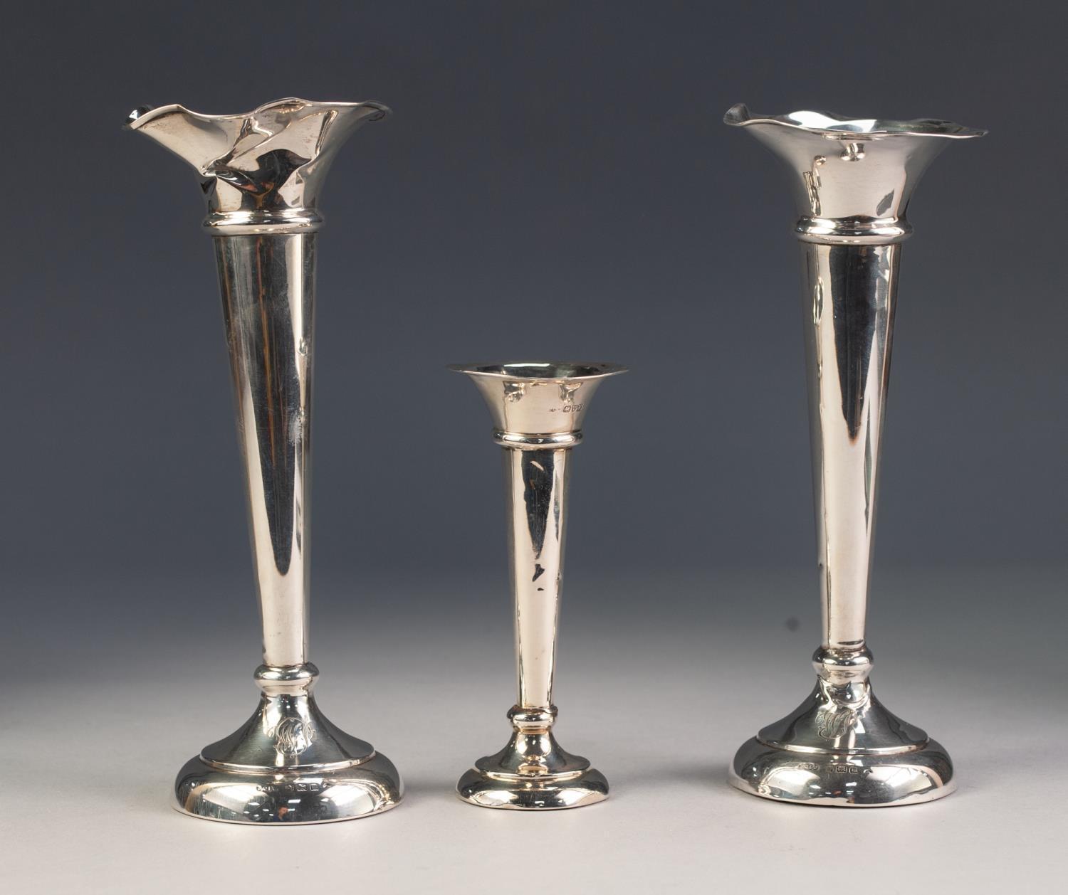 GEORGE V PAIR OF WEIGHTED SILVER TRUMPET VASES, of typical form, each monogrammed to the base,