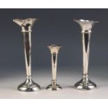 GEORGE V PAIR OF WEIGHTED SILVER TRUMPET VASES, of typical form, each monogrammed to the base,