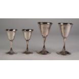 FOUR SILVER PLATE 'VALERO' SPANISH STEM WINE GOBLETS, two and two smaller having flared rims (4)