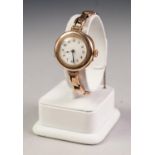LADY'S 'DREADNOUGHT' 9ct GOLD WRIST WATCH, with 15 jewels movement, Arabic white porcelain dial, and