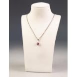 9ct WHITE GOLD SMALL TEAR SHAPED PENDANT set with a centre ruby and surround of twelve small