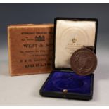 EDWARDIAN BRONZE PRIZE MEDALLION â€˜First in German 1906â€™, issued by the Irish Board, Dublin, in