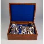 SMALL OAK CANTEEN CONTAINING A SELECTION OF ASSORTED PLATED CUTLERY including grape scissors etc,