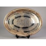 INDIAN ENGRAVED SILVER COLOURED METAL TRAY, of oval form with floral centre and border, unmarked, 15
