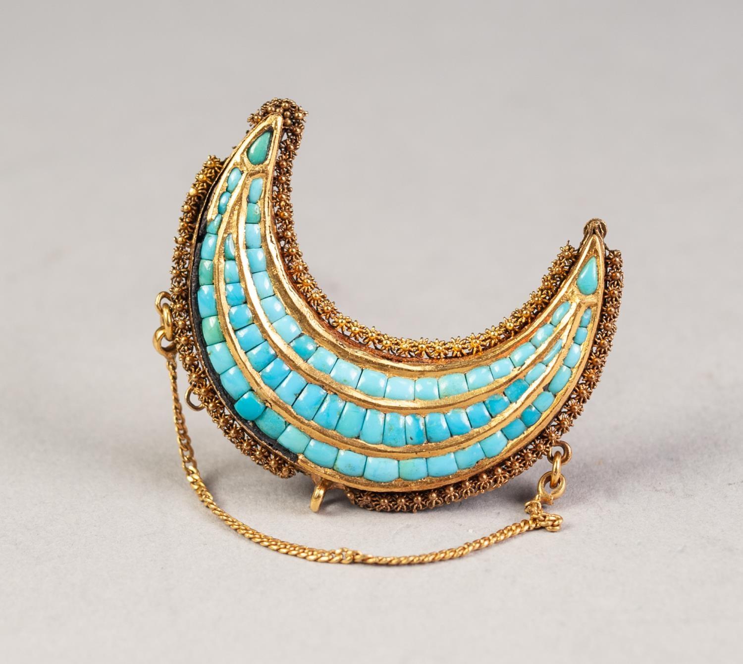 VICTORIAN GOLD COLOURED METAL CRESCENT BROOCH set with three rows of tiny turquoises and having a