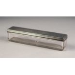 VICTORIAN ENGRAVED SILVER CUT GLASS DRESSING TABLE BOX WITH PULL-OFF SILVER COVER, of oblong form,