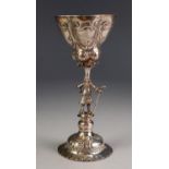 LATE VICTORIAN EMBOSSED SILVER FIGURAL PEDESTAL CHALICE CUP, the central column modelled as a