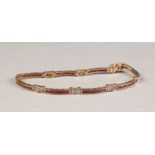 9ct GOLD RUBY AND DIAMOND BRACELET, the eight yellow golden curved bar links each set with eight