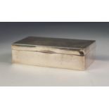 GEORGE V HEAVY SILVER TABLE CIGARETTE BOX, retailed by Prestons Ltd, of oblong form with engine