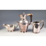 LATE VICTORIAN ELECTROPLATE HOT WATER JUG of shouldered ovular form with hinged lid having