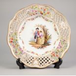 EARLY TWENTIETH CENTURY DRESDEN HAND PAINTED AND PIERCED PORCELAIN PLATE, with dished centre and