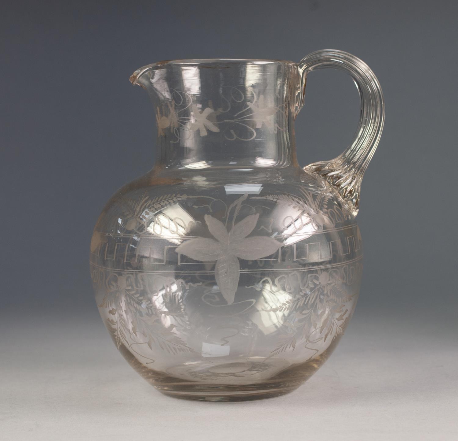 VICTORIAN ENGRAVED CLEAR GLASS WATER JUG, of baluster form with reeded handle to the neck, wheel cut