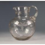 VICTORIAN ENGRAVED CLEAR GLASS WATER JUG, of baluster form with reeded handle to the neck, wheel cut