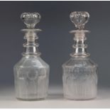 PAIR OF VICTORIAN ENGRAVED GLASS DECANTERS AND STOPPERS, each with triple ringed neck and hollow