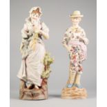 LARGE TINTED BISQUE FIGURE OF A LADY WITH A FAN, 15" HIGH AND FIGURE OF A GALLANT HOLDING A ROSE, 14