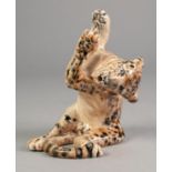 BARRY PITTER? STUDIO POTTERY MODEL OF A LEOPARD CUB, modelled seated, in playful pose with paws