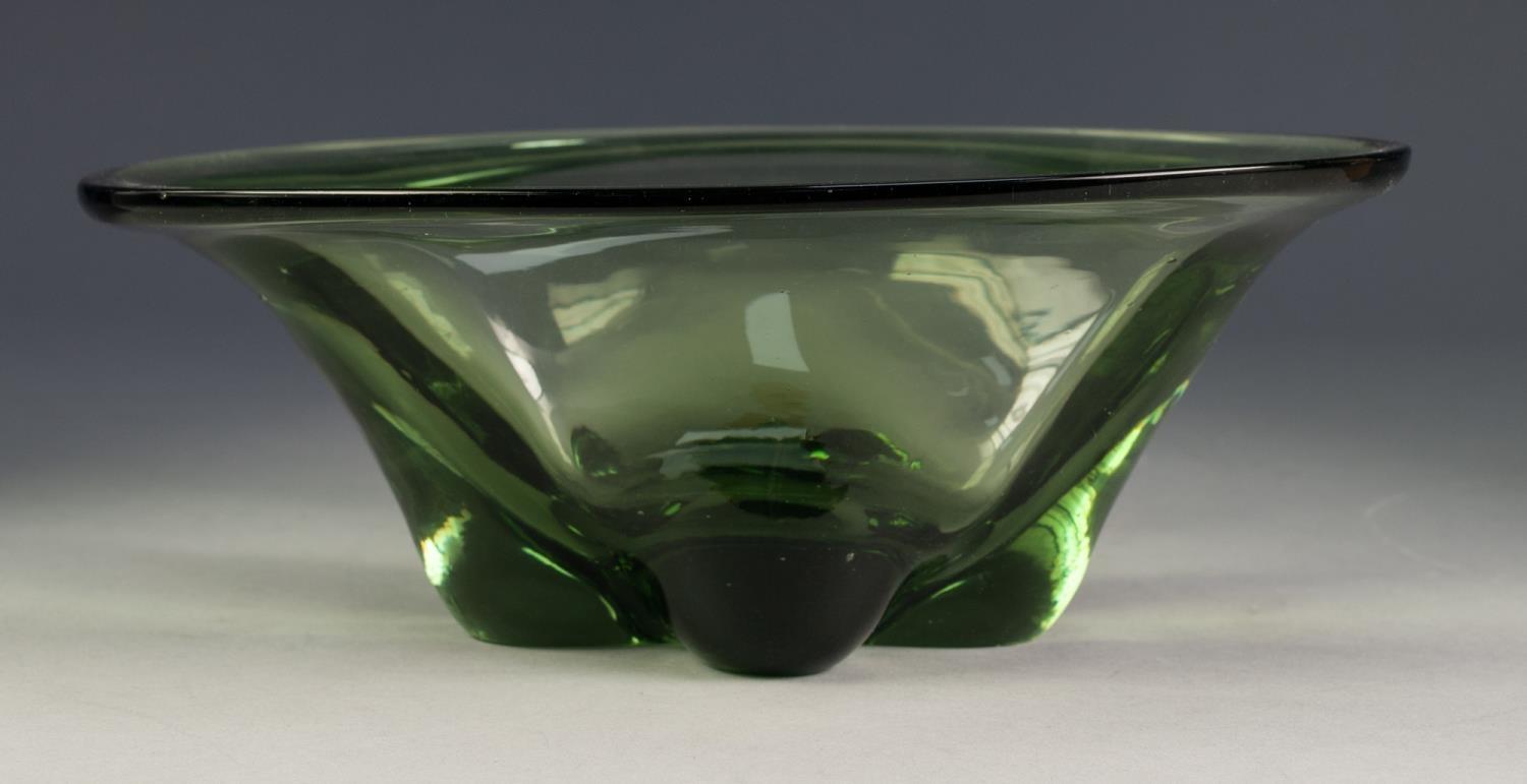 GREEN ART GLASS BOWL, of oval, steep sided form, with quatrefoil base, 4 ¼? (10.8cm) high, 11 ½? x 8