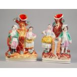 PAIR OF NINETEENTH CENTURY STAFFORDSHIRE FLAT BACK SPILL VASE GROUPS, each painted in colours and