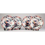 SET OF FOUR ?TONQUIN CHINA? IMARI STYLE POTTERY PLATES, each decorated with flowering garden urns,