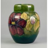 WALTER MOORCROFT CLEMATIS PATTERN TUBE LINED POTTERY GINGER JAR AND COVER, of typical form,