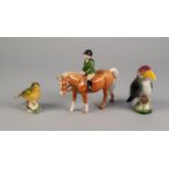 BESWICK POTTERY EQUESTRIAN FIGURE OF A BOY ON A PALOMINO PONY, (1500), 5 ½? (14cm) high, together