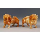 PAIR OF ORIENTAL CARVED BLOND VEINED HARDSTONE MODELS OF DOGS OF FO, each modelled standing, 3? (7.