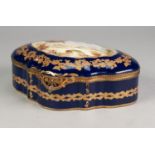EARLY 20th CENTURY FRENCH PORCELAIN PSEUDO-SEVRES BOX, cartouche shaped, with hinged cover and