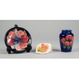 THREE SMALL PIECES OF WALTER MOORCROFT TUBE LINED POTTERY, comprising: ANENOME VASE, on a blue