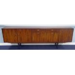1960's FRISTHO, DUTCH ROSEWOOD LONG LOW SIDEBOARD, the oblong top above a pair of end cupboard