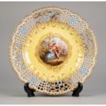 TWENTIETH CENTURY MEISSEN HAND PAINTED AND PIERCED PORCELAIN PLATE, of slightly dished form, the