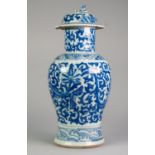 NINETEENTH CENTURY CHINESE BLUE AND WHITE PORCELAIN VASE AND COVER, of baluster form with dog of