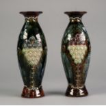 PAIR OF DOULTON LAMBETH MOULDED POTTERY VASES, each of slender ovoid form with waisted neck,