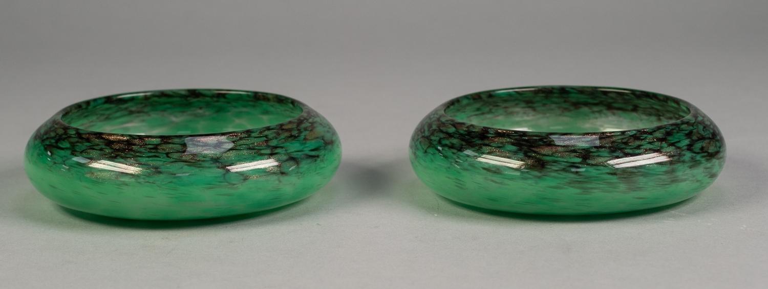 PAIR OF SCOTTISH, MONART LABELLED, SHALLOW GLASS DISHES, green mottled, with turned-in rims, with