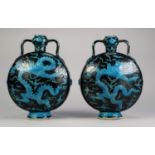 PAIR OF CHINESE ENAMELLED PORCELAIN MOON FLASKS, each of typical form with loop handles to the