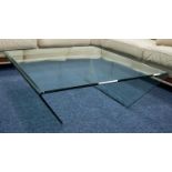 MODERN ONE PIECE MOULDED GLASS COFFEE TABLE, with oblong top and tapering end supports, 13 ½? (34.