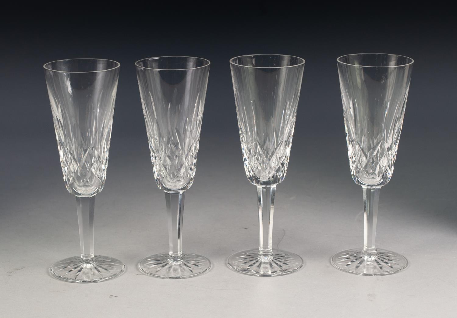 SET OF EIGHT WATERFORD CUT GLASS CHAMPAGNE FLUTES, stencilled mark, 7 ¼? (18.4cm) high, (8)