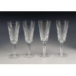 SET OF EIGHT WATERFORD CUT GLASS CHAMPAGNE FLUTES, stencilled mark, 7 ¼? (18.4cm) high, (8)