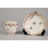 NINETEENTH CENTURY DERBY CHINA TEA CUP AND SAUCER, painted in colours and gilt with meandering