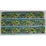 SET OF NINE WILLIAM DE MORGAN POTTERY FRIEZE TILES, each of oblong form, painted in colours with a