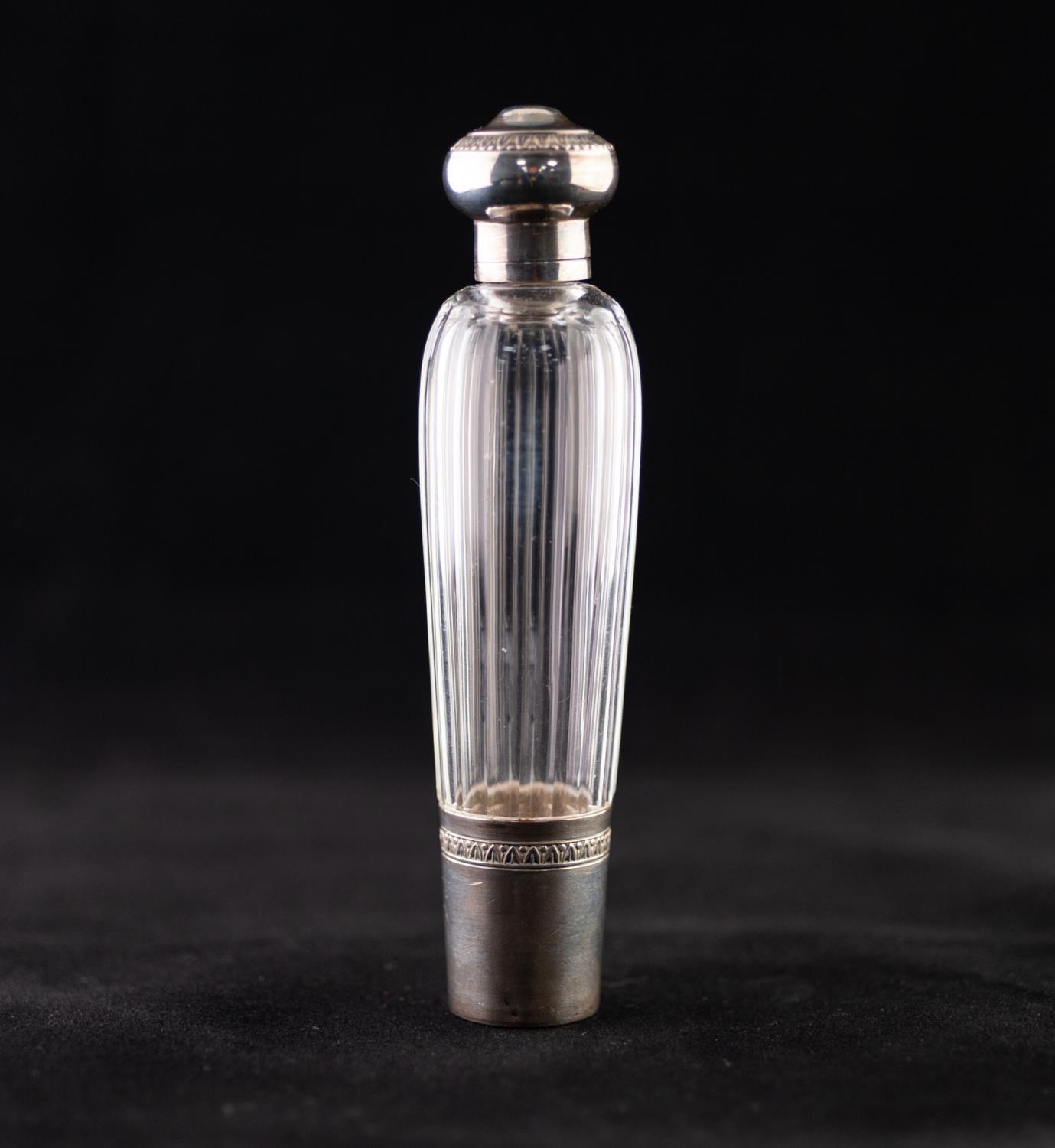 A LATE 19TH CENTURY FRENCH FACETED CLEAR GLASS WHITE METAL MOUNTED SCENT BOTTLE