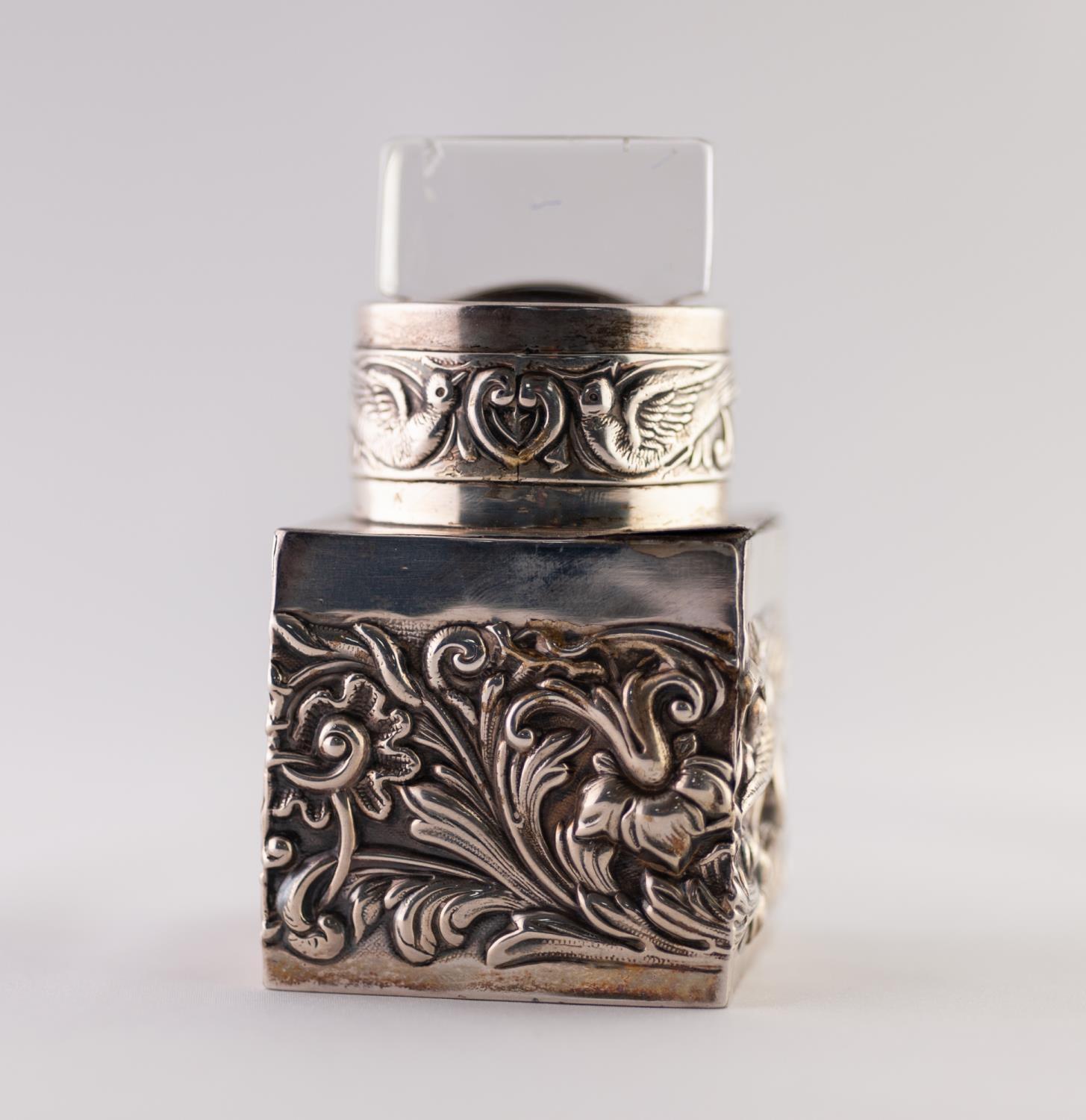 A LATE VICTORIAN SILVER INCASED PRESSED GLASS SCENT BOTTLE, stamped with birds amongst floriated