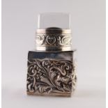 A LATE VICTORIAN SILVER INCASED PRESSED GLASS SCENT BOTTLE, stamped with birds amongst floriated