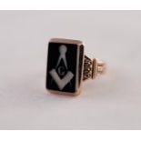 A MASONIC INTALGIO SIGNET RING, a rectangular plaque with an engraved Masonic motif, to fancy