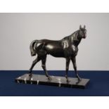 EARLY TWENTIETH CENTURY BRONZE MODEL OF A RACE HORSE, modelled standing, facing right, raised on a