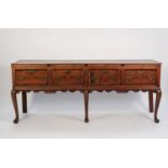 LATE EIGHTEENTH CENTURY CROSSBANDED OAK DRESSER BASE, the moulded oblong top above four deep