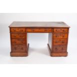 VICTORIAN POLLARD OAK TWIN PEDESTAL DESK, polished as walnut, the canted oblong top with gilt tooled