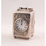 EDWARDIAN SILVER CASED CARRIAGE CLOCK, THE CIRCULAR WHITE ENAMEL DIAL WITH ROMAN HOUR NUMERALS