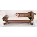 PROBABLY COLONIAL REGENCY TEAKWOOD AND CANED SCROLL END CHAISE LONGUE, with cane work back and seat,