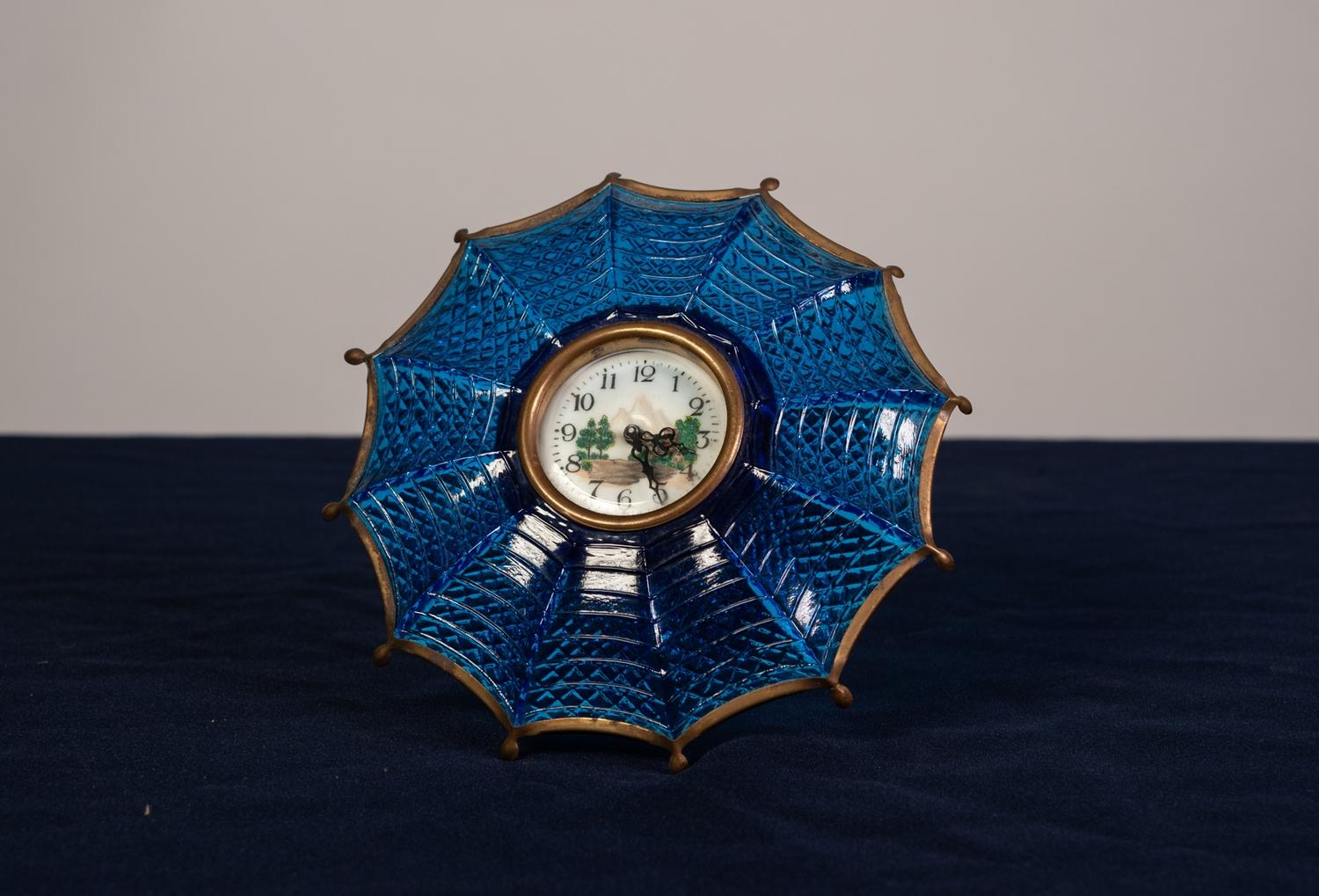 UNUSUAL CIRCA 1930's MOULDED BLUE GLASS AND GILT METAL UMBRELLA SHAPED DRESSING TABLE CLOCK