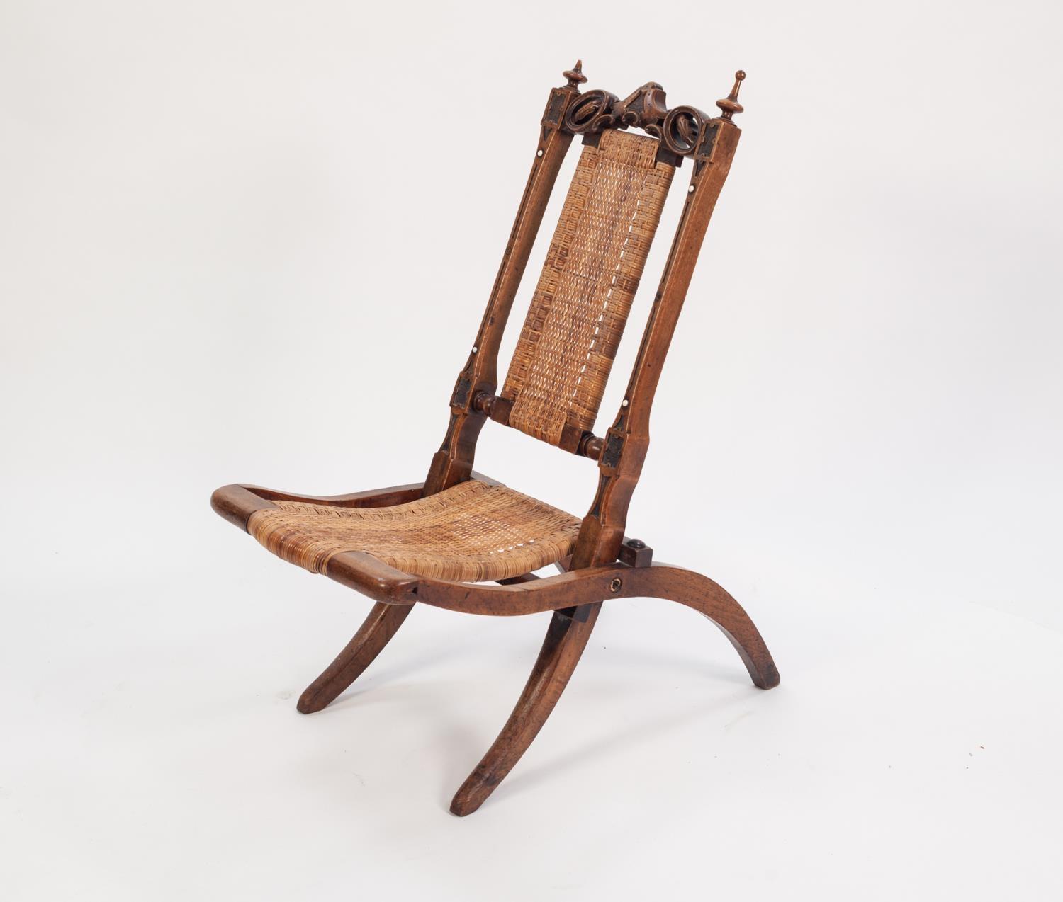 VICTORIAN CARVED WALNUT CHILD?S STEAMER CHAIR, of typical form with foliate carved and pieced top